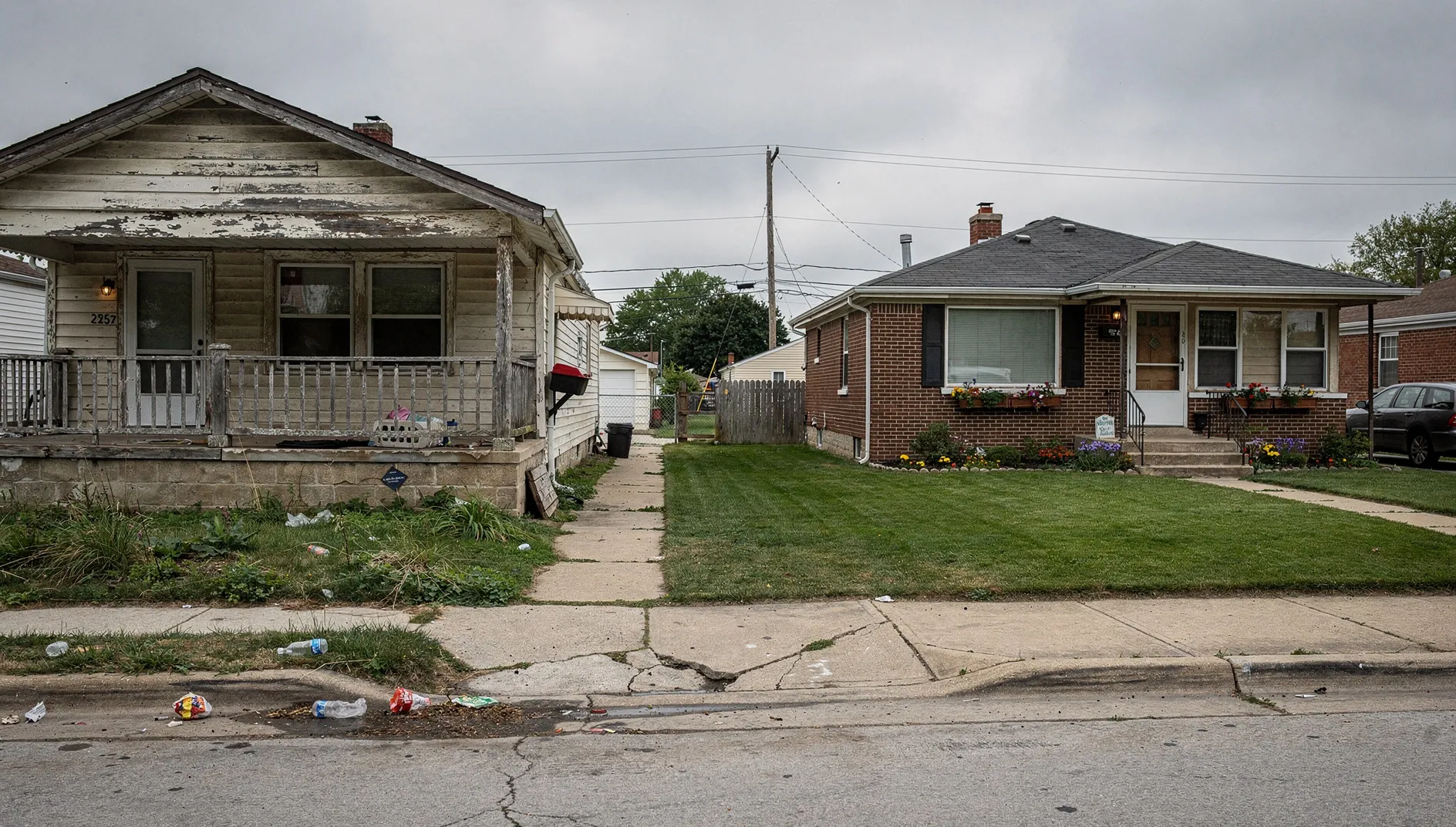 Milwaukee neighborhood homes — fixer and well-kept side by side